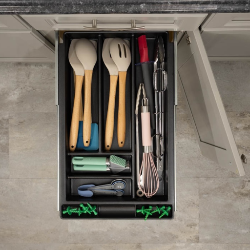 Overhead view of the utensil  drawer filled with cooking tools
